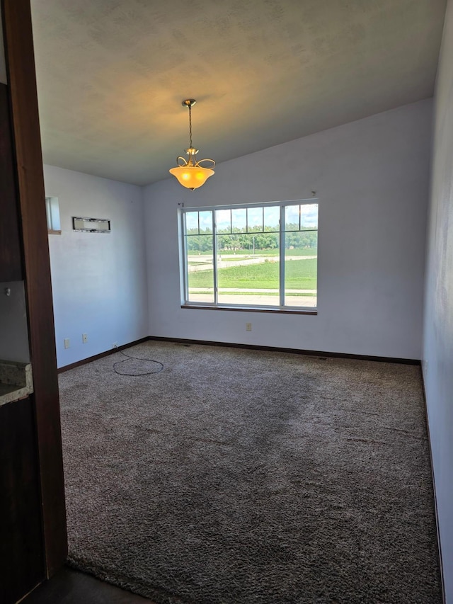 1719 Grand Ave, Worthington, MN 56187 - unfurnished room featuring dark carpet and baseboards