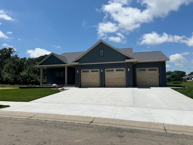 2329 9th St W, Albert Lea, MN 56007 - view of front of property featuring an attached garage, a front yard, concrete driveway, and a porch