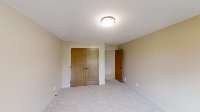 2329 9th St W, Albert Lea, MN 56007 - hall featuring light carpet and baseboards