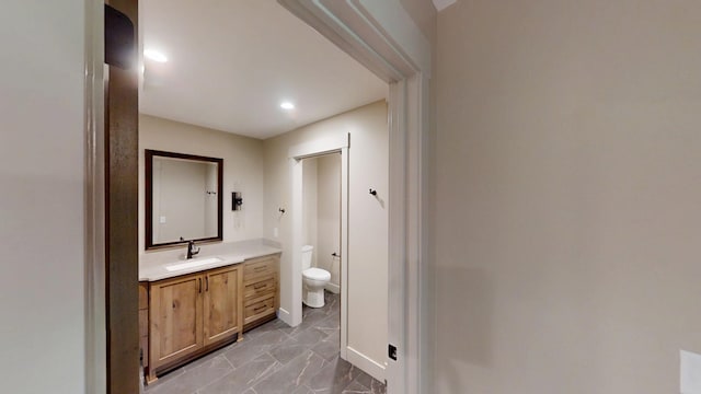 2329 9th St W, Albert Lea, MN 56007 - bathroom featuring marble finish floors, vanity, and recessed lighting