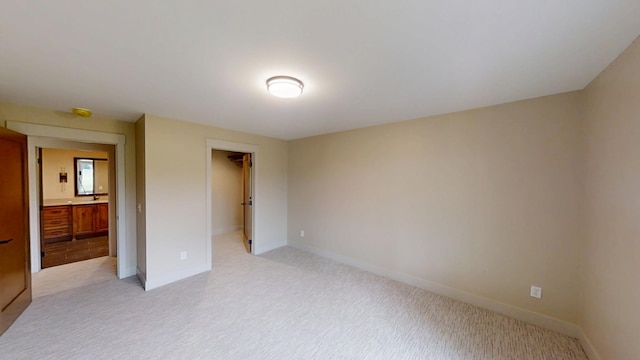 2329 9th St W, Albert Lea, MN 56007 - unfurnished bedroom featuring light colored carpet and a spacious closet