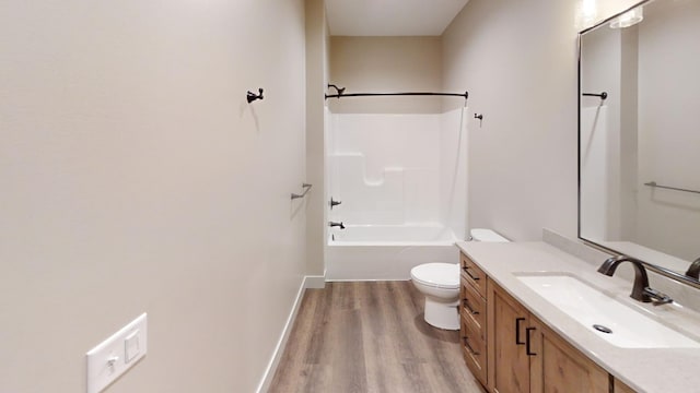2329 9th St W, Albert Lea, MN 56007 - bathroom with wood finished floors, vanity, and bathing tub / shower combination