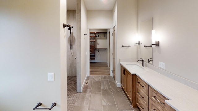 2329 9th St W, Albert Lea, MN 56007 - bathroom with vanity, tiled shower, and a spacious closet