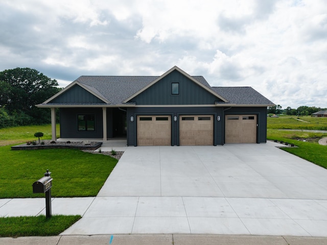 2329 9th St W, Albert Lea, MN 56007 - view of front of property with an attached garage, a front yard, a porch, and board and batten siding