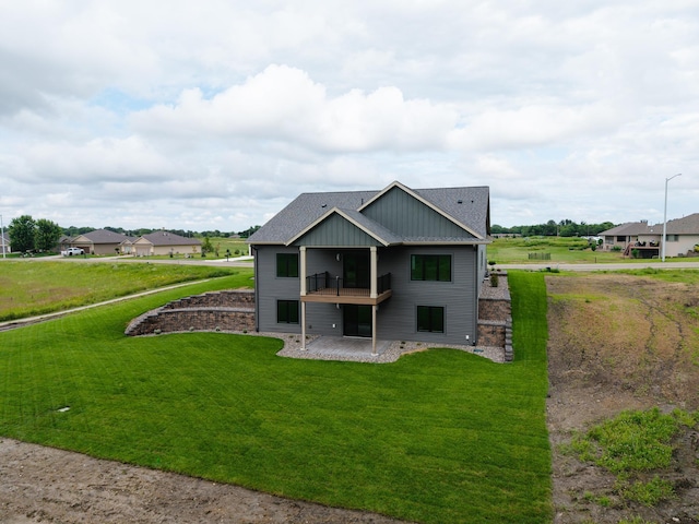 2329 9th St W, Albert Lea, MN 56007 - rear view of property with a lawn, a shingled roof, a patio, and a balcony