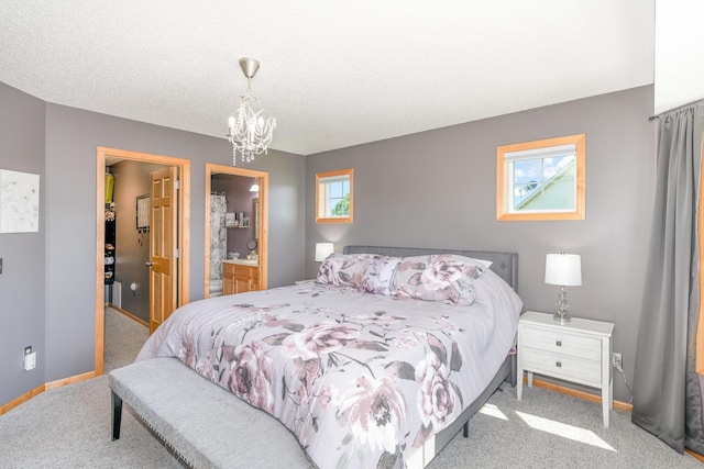 9742 Saint Andrews Dr, Elko New Market, MN 55020 - bedroom featuring multiple windows, a spacious closet, carpet flooring, and a chandelier