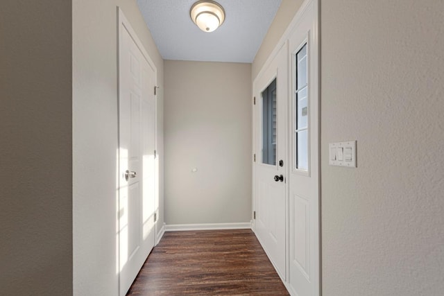 2112 York St, Saint Peter, MN 56082 - doorway to outside featuring dark wood-style floors and a textured wall