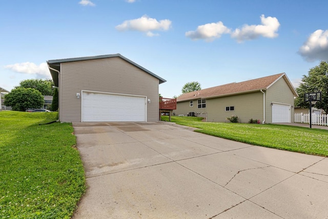 2112 York St, Saint Peter, MN 56082 - view of side of home with a yard and a garage