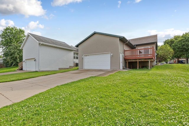 2112 York St, Saint Peter, MN 56082 - view of property exterior with a garage, a yard, a deck, and driveway