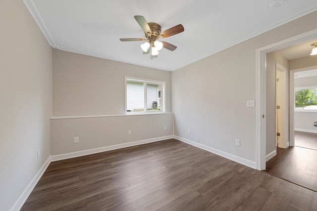 2112 York St, Saint Peter, MN 56082 - empty room with dark wood-style flooring, ceiling fan, ornamental molding, and a smoke detector