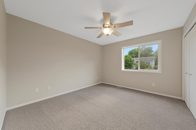 2112 York St, Saint Peter, MN 56082 - carpeted empty room featuring baseboards and a ceiling fan