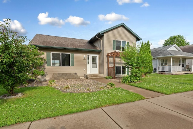 2112 York St, Saint Peter, MN 56082 - split level home featuring a front lawn, a pergola, a porch, and roof with shingles