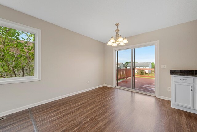 2112 York St, Saint Peter, MN 56082 - unfurnished dining area featuring a chandelier and dark wood-style flooring