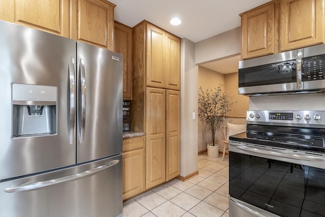 385 Lexington Ave, Le Center, MN 56057 - kitchen with appliances with stainless steel finishes, light tile patterned floors, and recessed lighting