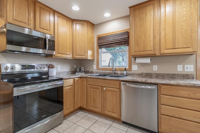 385 Lexington Ave, Le Center, MN 56057 - kitchen with appliances with stainless steel finishes, light tile patterned flooring, and recessed lighting