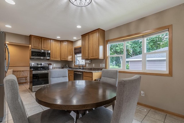 385 Lexington Ave, Le Center, MN 56057 - kitchen featuring stainless steel appliances, light tile patterned floors, and recessed lighting