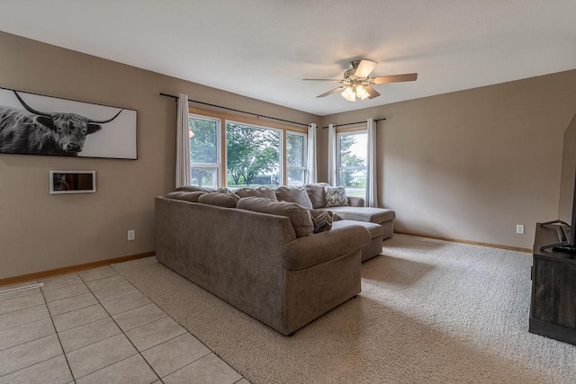 385 Lexington Ave, Le Center, MN 56057 - living room with a ceiling fan, light tile patterned floors, and light carpet