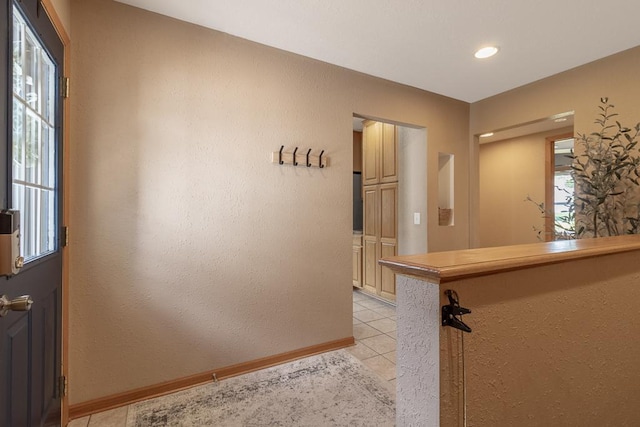 385 Lexington Ave, Le Center, MN 56057 - hallway with light tile patterned floors, a textured wall, and recessed lighting