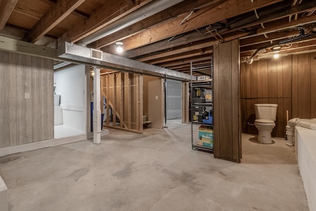 385 Lexington Ave, Le Center, MN 56057 - unfinished basement with stairway and wood walls