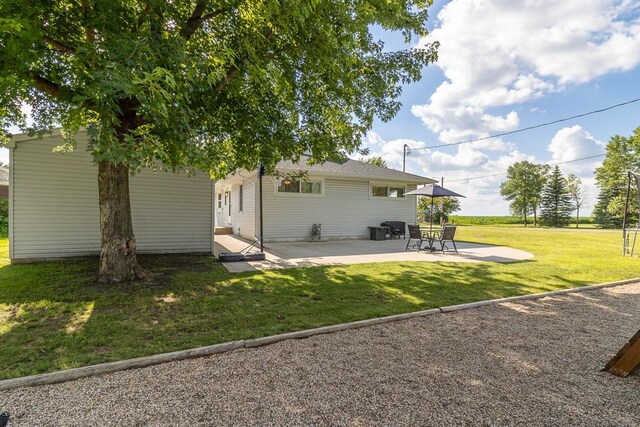 385 Lexington Ave, Le Center, MN 56057 - back of house featuring a patio and a yard