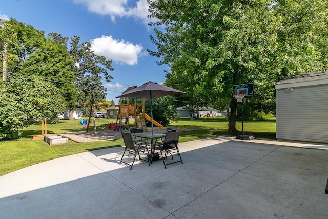 385 Lexington Ave, Le Center, MN 56057 - view of patio with a playground and outdoor dining space