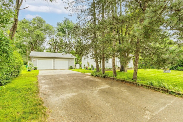 536 County Road J W, Shoreview, MN 55126 - view of front facade featuring a garage, a front yard, concrete driveway, and an outdoor structure