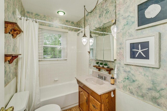 536 County Road J W, Shoreview, MN 55126 - bathroom with wallpapered walls, vanity, and shower / bath combo with shower curtain