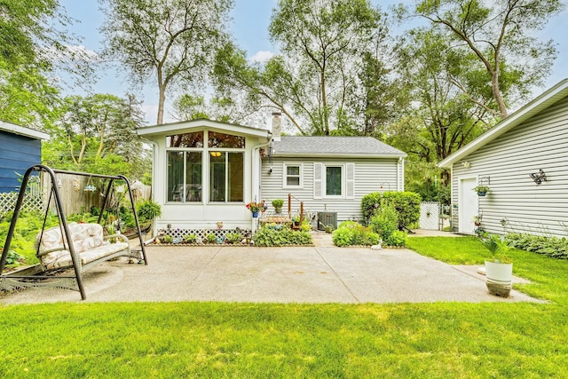 536 County Road J W, Shoreview, MN 55126 - rear view of property with a patio area, a chimney, and a sunroom