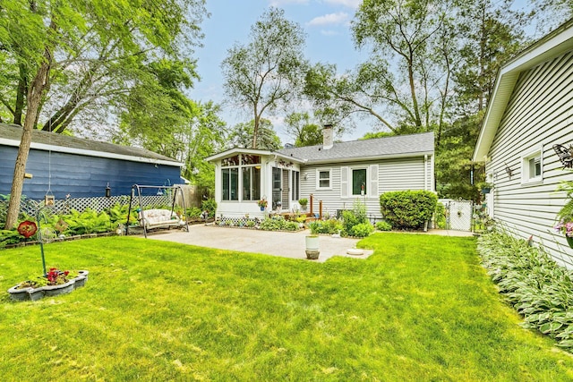 536 County Road J W, Shoreview, MN 55126 - rear view of house with a sunroom, a gate, a chimney, and a patio