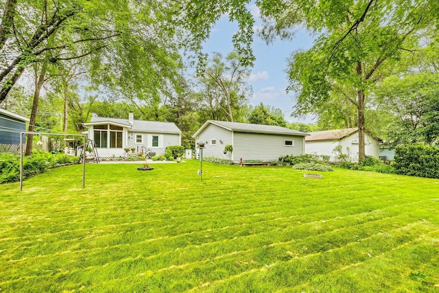536 County Road J W, Shoreview, MN 55126 - view of grassy yard with a sunroom
