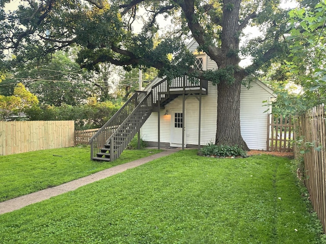 1699 Malvern St, Lauderdale, MN 55113 - rear view of house featuring stairway, a fenced backyard, and a deck