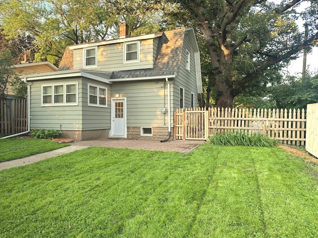 1699 Malvern St, Lauderdale, MN 55113 - back of house featuring a chimney, roof with shingles, a patio, and a gambrel roof