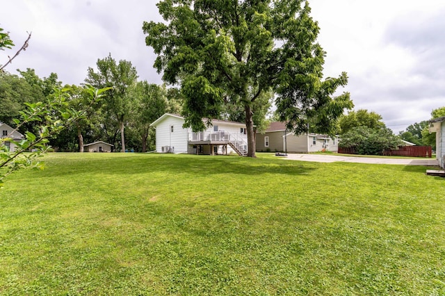 516 Gustavus Ave, Fergus Falls, MN 56537 - view of green lawn with a deck and stairway