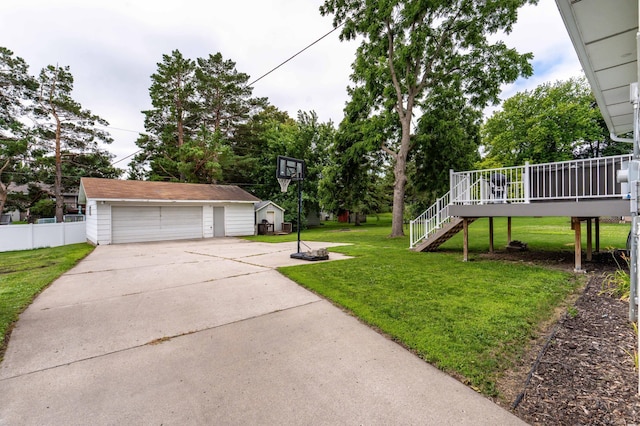 516 Gustavus Ave, Fergus Falls, MN 56537 - view of yard with an outbuilding, stairs, a detached garage, and a wooden deck