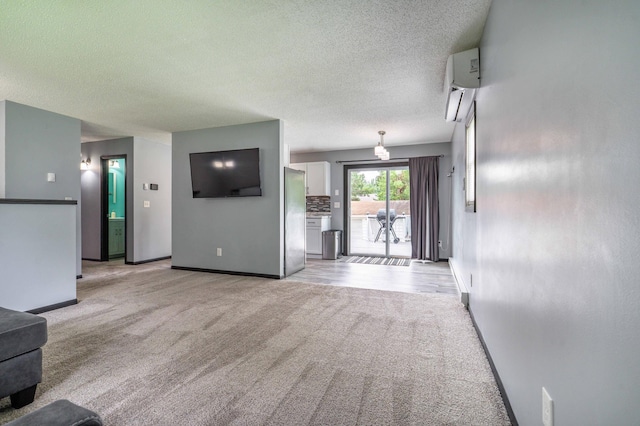 516 Gustavus Ave, Fergus Falls, MN 56537 - unfurnished living room with light colored carpet, a wall mounted AC, and a textured ceiling