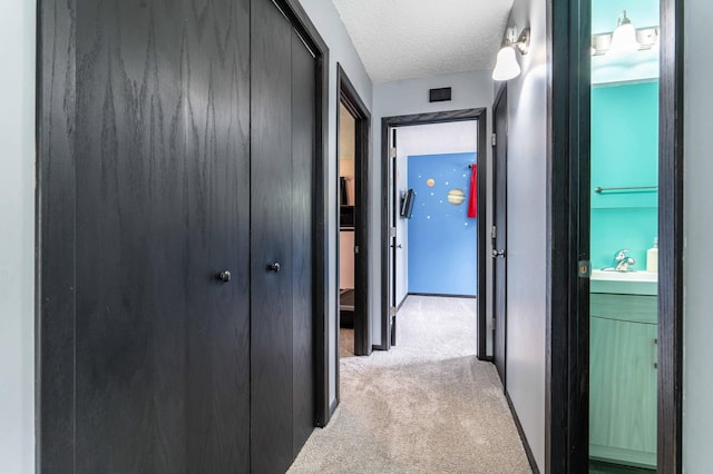 516 Gustavus Ave, Fergus Falls, MN 56537 - hallway featuring light colored carpet and a textured ceiling