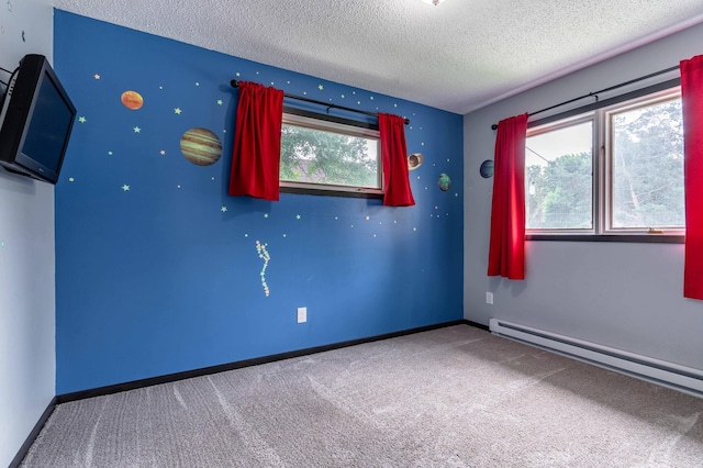 516 Gustavus Ave, Fergus Falls, MN 56537 - carpeted spare room featuring a textured ceiling and a baseboard heating unit