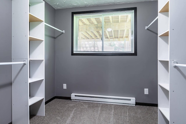 516 Gustavus Ave, Fergus Falls, MN 56537 - walk in closet featuring a baseboard heating unit and carpet floors