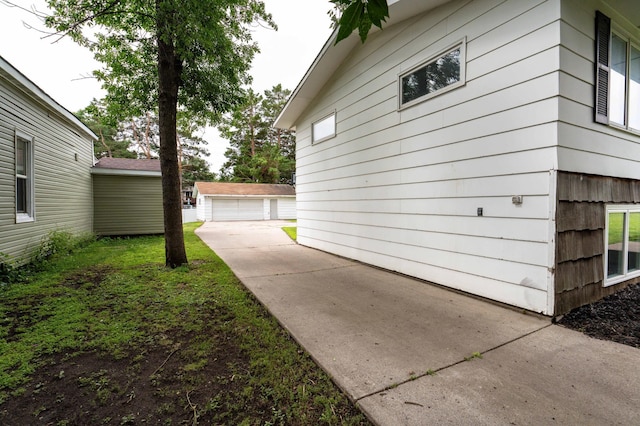 516 Gustavus Ave, Fergus Falls, MN 56537 - view of home's exterior featuring a detached garage and an outdoor structure