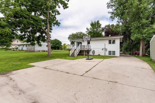 516 Gustavus Ave, Fergus Falls, MN 56537 - back of house with stairs, a yard, and a deck
