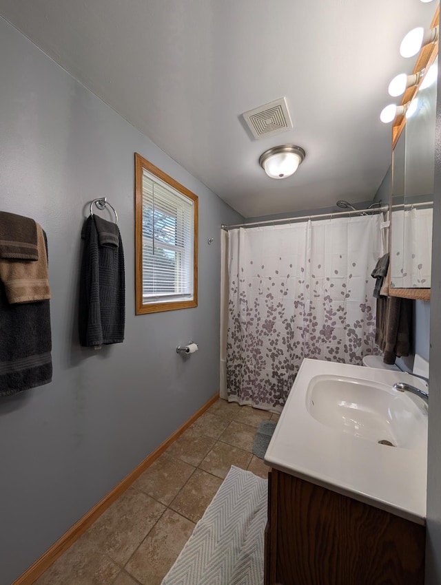 202 Hill St, Russell, MN 56169 - full bathroom featuring vanity, tile patterned floors, and curtained shower