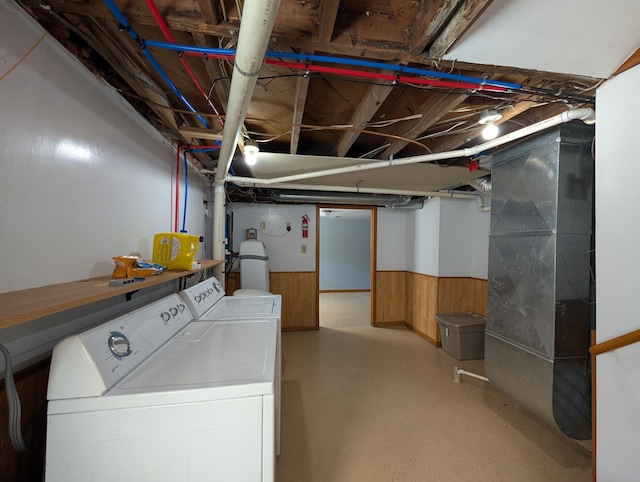 202 Hill St, Russell, MN 56169 - unfinished below grade area featuring independent washer and dryer, wainscoting, wooden walls, and a water softener