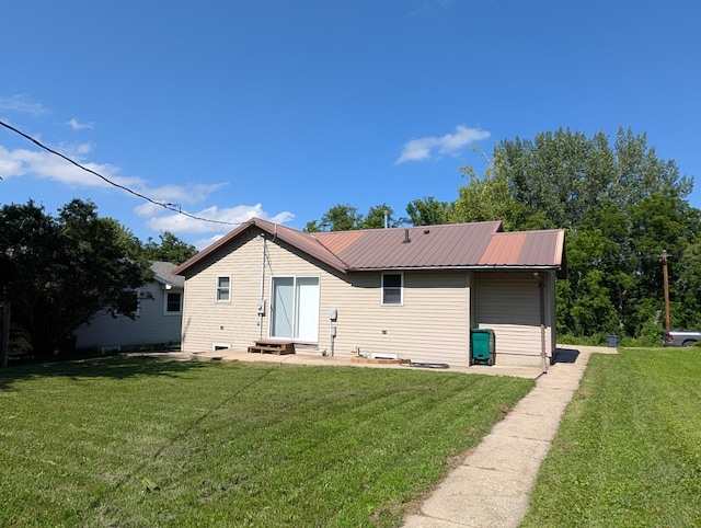 202 Hill St, Russell, MN 56169 - rear view of house featuring a yard, a metal roof, and entry steps