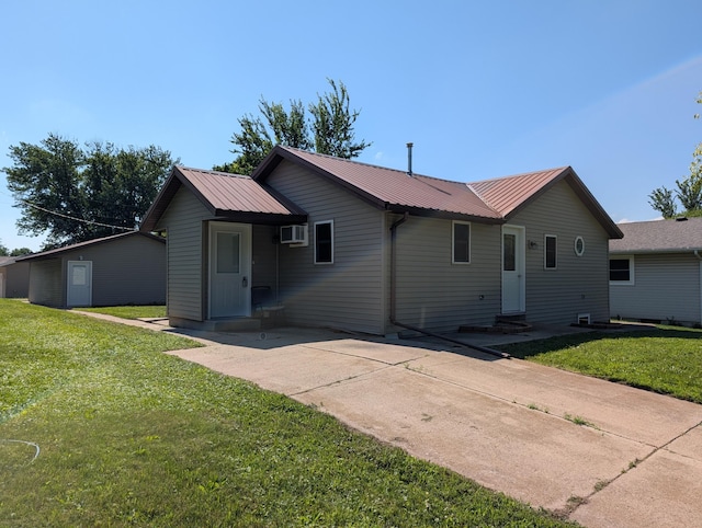 202 Hill St, Russell, MN 56169 - ranch-style home with entry steps, a front lawn, a metal roof, and a patio