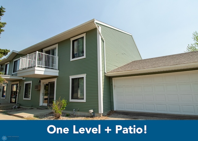 3209 15th Ave S Unit B, Fargo, ND 58103 - view of side of home featuring a balcony and an attached garage