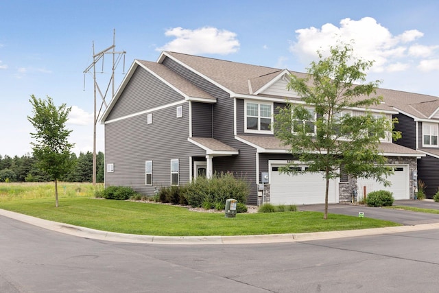 8800 Granite Pass, Woodbury, MN 55129 - view of front of property with a garage, asphalt driveway, a front yard, and a shingled roof