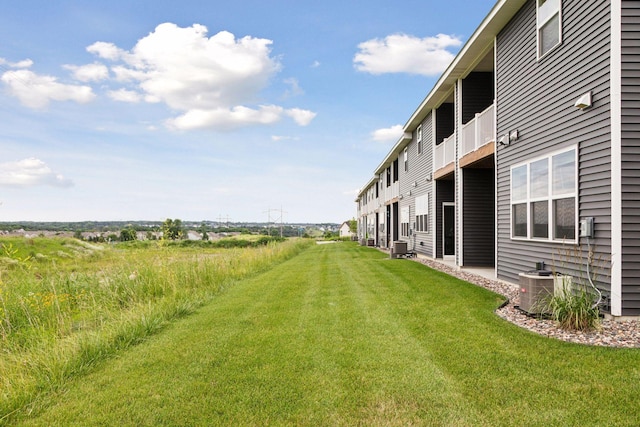 8800 Granite Pass, Woodbury, MN 55129 - view of grassy yard featuring a balcony