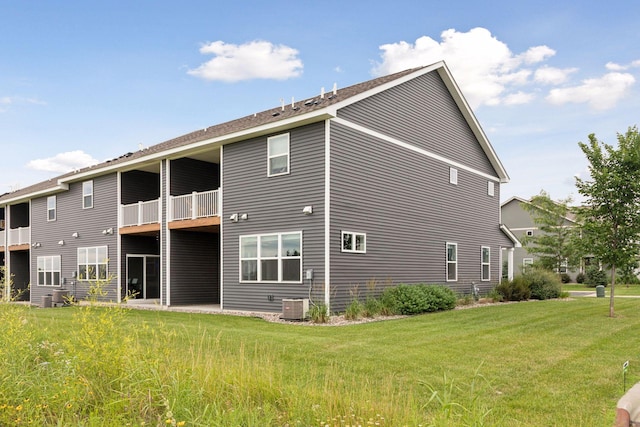 8800 Granite Pass, Woodbury, MN 55129 - back of house featuring a balcony and a yard