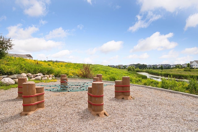8800 Granite Pass, Woodbury, MN 55129 - view of patio / terrace with a water view