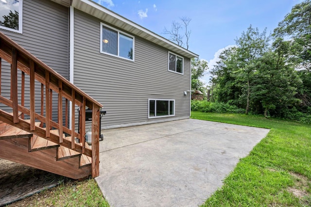 13143 Jefferson St, Becker, MN 55308 - back of house featuring a patio area and a lawn